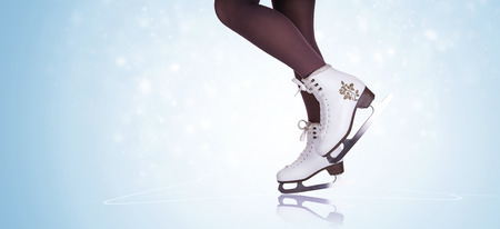 Woman legs in ice skating bootsの写真素材