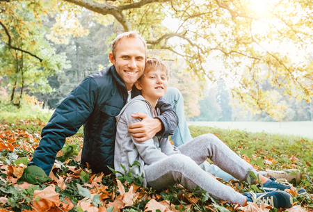 Father and son autumn portraitの写真素材