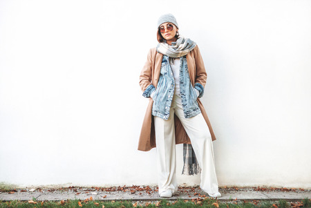 Woman posing in multilayered autumn outfitの写真素材