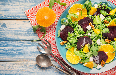 Fresh salsd with beetroot, orange and arugula. Vitamin rich and healthy food. Light nutrition for holiday time. Vegetarian nutritionの写真素材