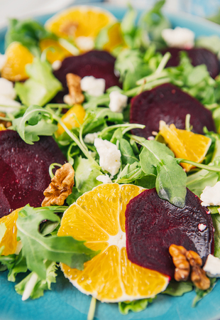 Fresh vegetable salad with beetroot, orange and arugulaの写真素材