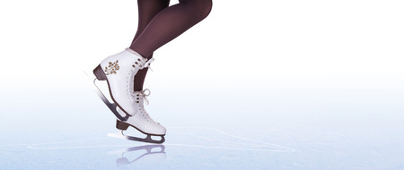 Woman legs in ice skating bootsの写真素材