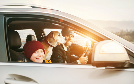 Father with son and beagle dog traveling together by auto right door angle shootの写真素材
