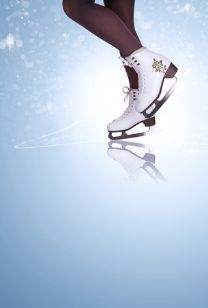 Woman legs in ice skating bootsの写真素材