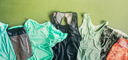 Sets of the fitness sport clothes are on the training joga matの写真素材