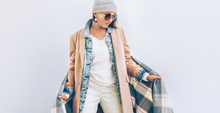 Woman dressed elegant outfit with oversize denim jacket .  Modern fashion outfit concept image.の写真素材