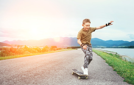 Boy learn to skate on skateboardの写真素材