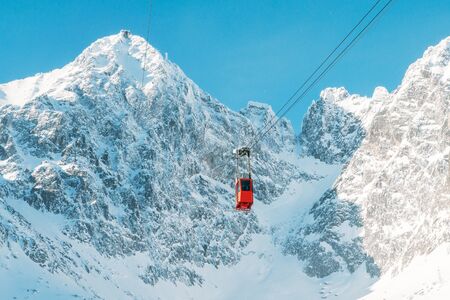 Tatra Mountains Ski Resort beautiful view on mountains peaks with red gondolaの写真素材