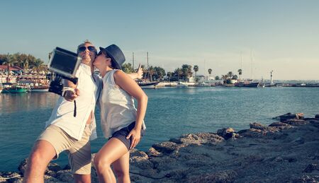 Young couple take their kissing self photoの写真素材