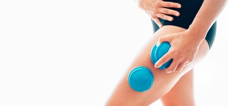 Female making massage using a silicone cup for vacuum cupping anti-cellulite Massage Therapyの写真素材