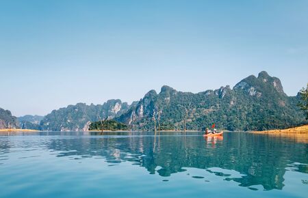 Mother and son floating on kayak together on Cheow Lan lake in Thailandの写真素材