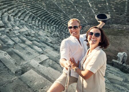 Couple take summer selfie  in the ancient Theaterの写真素材