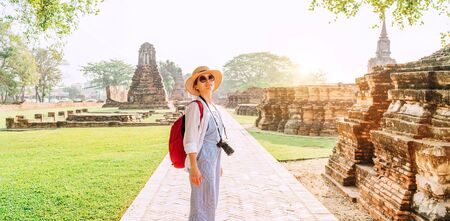 Young backpacker Tourist woman enjoying walking at ancient ruinsの写真素材