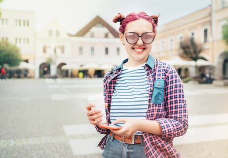Portrait of Beautiful modern young female teenager with extraordinary hairstyle in checkered shirt withの写真素材