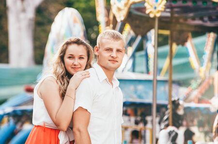 Portrait of two young people walking at the city park posing at the camera.の写真素材
