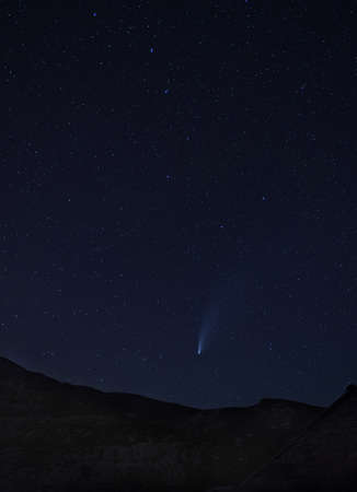 Long period comet C/2020 F3 (NEOWISE) with tail visible in night sky above the Dinara mountain in Dinaric Alps on the border between Croatia and Bosnia and Herzegovina. Iの写真素材