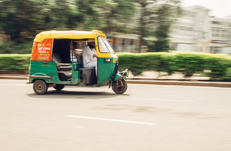 New Delhi, India - AUGUST 13: Moto-Rickshaw in motion, New Delhi, India on AUGUST 13, 2016 in New...