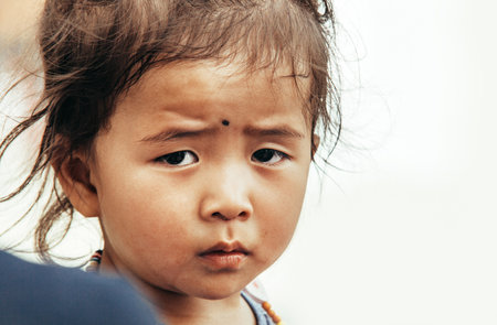 Thiksay Monastery in Thiksey village, India - August 20, 2016: Cute tibetan little girl portrait in Thiksey village, Indiaのeditorial素材