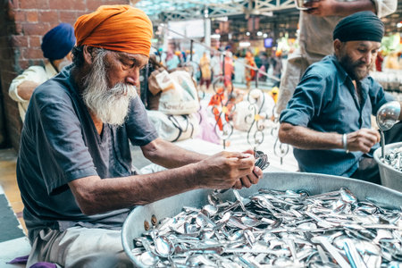 Amritsar, India â€“ August 15, 2016: Sikh volunteers in Golden Temple free canteen. This is the...