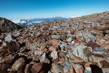 French Alps breathtaking rocky stones field landscape. Mont Blanc ascedding French trekking route.