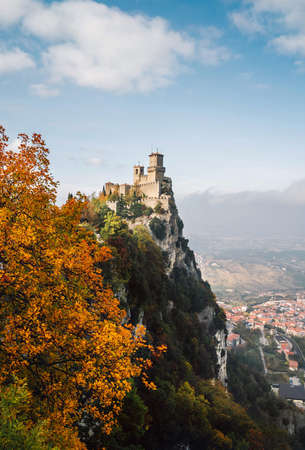 The tower of Fortress of Guaita on Monte Titano mountain - the highest in Republic of San Marino. Autumn landscape view overlooking the 
Valdragone city.の写真素材