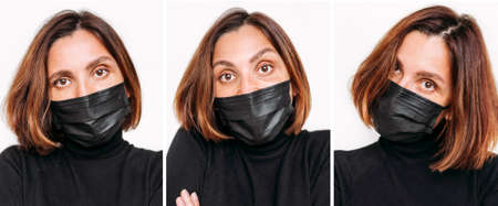 Woman's portraits with surprised face emotion in black facial mask looking at camera during COVID-19 world pandemic.Self-protection and stop virus spreading measures concept imageの写真素材