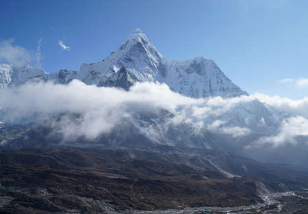 Ama Dablam 6814m clouds covered peak View near Dingboche settlement in Sagarmatha National Park, Nepal. Everest Base Camp (EBC) trekking route.の写真素材