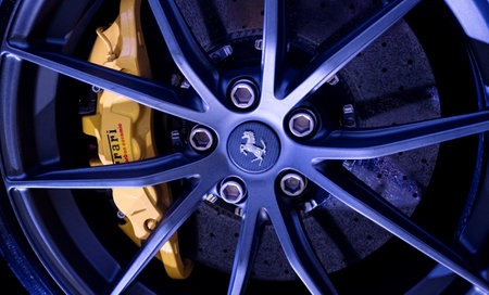 Modena, Italy - July 14, 2021: Light Alloy wheel, carbon-ceramic brake disc with yellow Brembo caliper Ferrari F12TDF Tour de France high-performance Italian sport in Museo Casa Enzo Ferrari, Italy.のeditorial素材