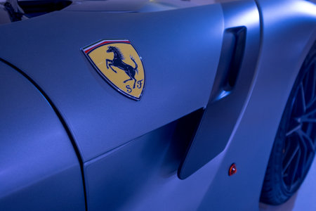 Modena, Italy - July 14, 2021: Black prancing horse on yellow Logo on Gray Ferrari F12TDF Tour de France model high performance Italian sport car wing in Museo Casa Enzo Ferrari, Italy.のeditorial素材
