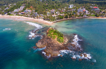 Mirissa sandy Parrot Rock island landmark aerial photo with a beautiful bay in Matara District on Sri Lanka. Exotic Asian countries and around the World traveling concept.の写真素材