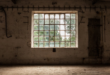 Gridded wide window on the old vintage wall. Grunge image technique concept image.の写真素材