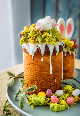 Paska - the Easter Eve sweet bread with icing decorated with eatable "moss" still life. Popular dessert during Eastern Orthodox Easter Holiday. Old cultures traditions and healthy eating concept imageの写真素材