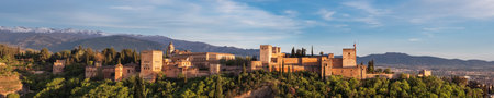 Seville, Spain - April 12, 2023: Alhambra medieval palace and fortress complex with Sierra Nevada snowy mountains in Granada, Andalusia, Spainのeditorial素材