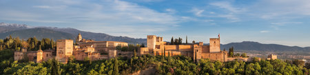 Seville, Spain - April 12, 2023: Alhambra medieval palace and fortress complex with Sierra Nevada snowy mountains in Granada, Andalusia, Spainのeditorial素材