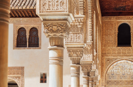 Marble capitals and stucco decoration of the portico in Court of Myrtles in Comares Palace Alhambra, Andalusia, Spain. Magic breathtaking carved decoration in Orient style.のeditorial素材