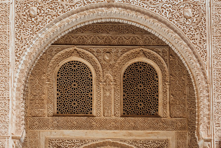 Marble capitals and stucco decoration of the portico in Patio del Cuarto Dorado in Mexuar in Comares Palace Alhambra, Andalusia, Spain. Magic breathtaking carved decoration  in orient style.のeditorial素材