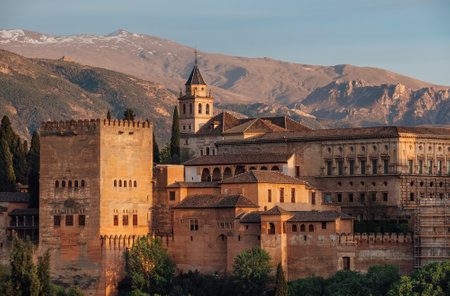 Charles V Palace and Church of Santa Maria de la Alhambra in medieval fortress complex with Sierra Nevada snowy mountains, Andalusia, Spain. Known as a Capital of Nasrid Kingdom or Emirate of Granada.のeditorial素材