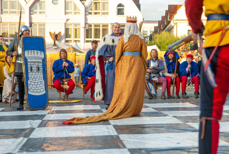Zilina, Slovak RepubliÑ, Slovakia - July 28, 2023: Live chess figurines dressed in medieval costumes and armours during traditional annual restoration known as a "Stredoveky den" in Zilina, Slovakia.のeditorial素材