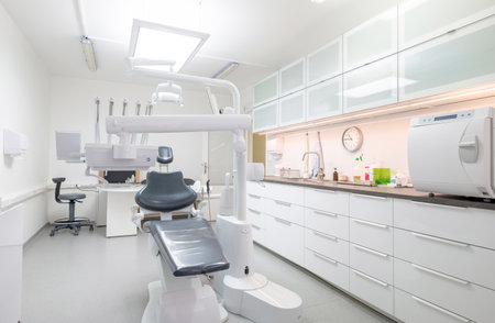 Comfortable Dental Chair Unit with Luxury Dental Chair in Dentist doctor clinic modern medical ward. Health care, medicare industry, heathcare technology concept imageの写真素材