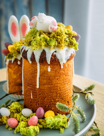 Paska - the Easter Eve sweet bread with icing decorated with eatable "moss" still life. Popular dessert during Eastern Orthodox Easter Holiday. Old cultures traditions and healthy eating concept imageの写真素材