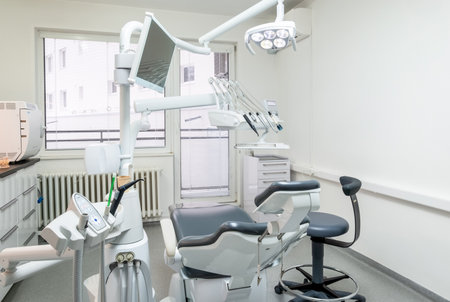 Comfortable Dental Chair Unit with Luxury Dental Chair in Dentist doctor clinic modern medical ward. Health care, medicare industry, heathcare technology concept imageの写真素材
