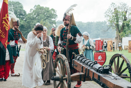 ÄervenÃ½ KameÅ Castle, Slovakia - May 25, 2024: People in medieval attires historical reenactment event. Reconstructions provide valuable insights into daily life, past eras traditions in Slovakia.のeditorial素材
