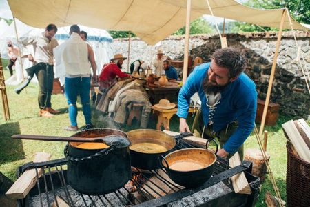 ÄervenÃ½ KameÅ Castle, Slovakia - May 25, 2024: People in medieval attires historical reenactment event. Reconstructions provide valuable insights into daily life, past eras traditions in Slovakia.のeditorial素材