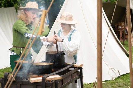 ÄervenÃ½ KameÅ Castle, Slovakia - May 25, 2024: People in medieval attires historical reenactment event. Reconstructions provide valuable insights into daily life, past eras traditions in Slovakia.のeditorial素材