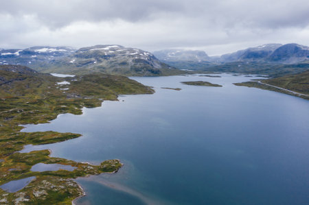Norvegian severe Tundra nature - lake and mountains with birdsyey top view. Picturesque northern Norway landscape aerial photo. Rondane National Park, Norwayの写真素材