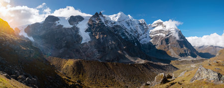 Panoramic photo Mera peak 6476m with glacier lakes and snowy summits covered in white clouds. Himalayas climbing route near the Khare settlement, Makalu Barun National Park trek in Nepal.の写真素材