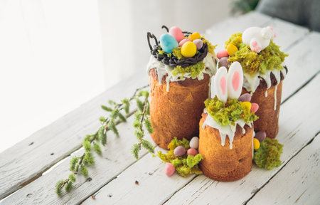 Paska - Easter Eve sweet bread with icing decorated with eatable "moss" still life with willow. Popular dessert during Eastern Orthodox Easter. Old cultures traditions and healthy eating concept imageの写真素材