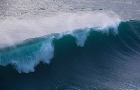 Huge Atlantic ocean wave during international surfers challenge at Praia do Norte in Nazare, Farol da NazarÃ©, Portugal where Guinness World Record for the highest surfing was setの写真素材
