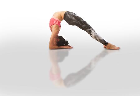 beautiful woman doing yoga on a white background