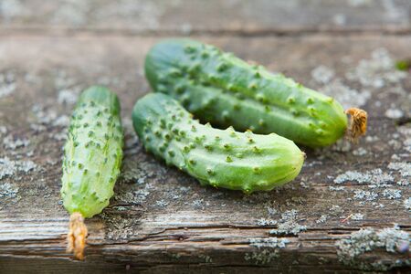 fresh cucumber on wooden tableの写真素材